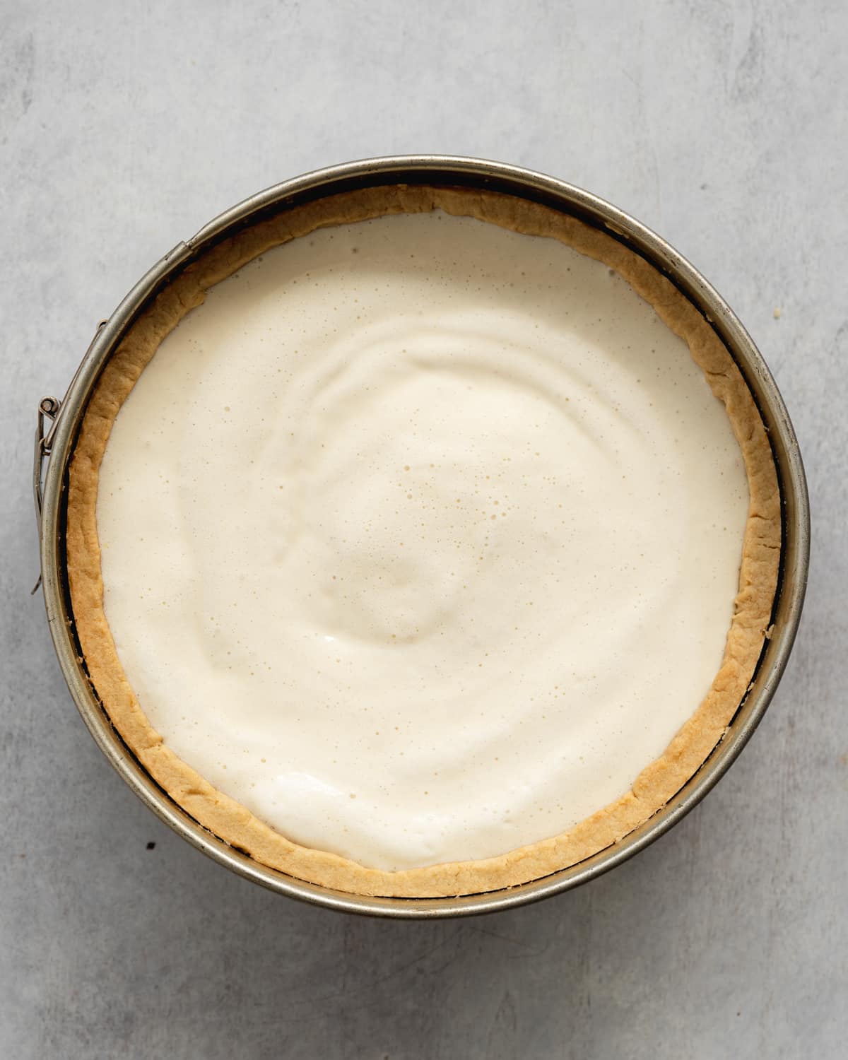 cheesecake in a pan before baking.