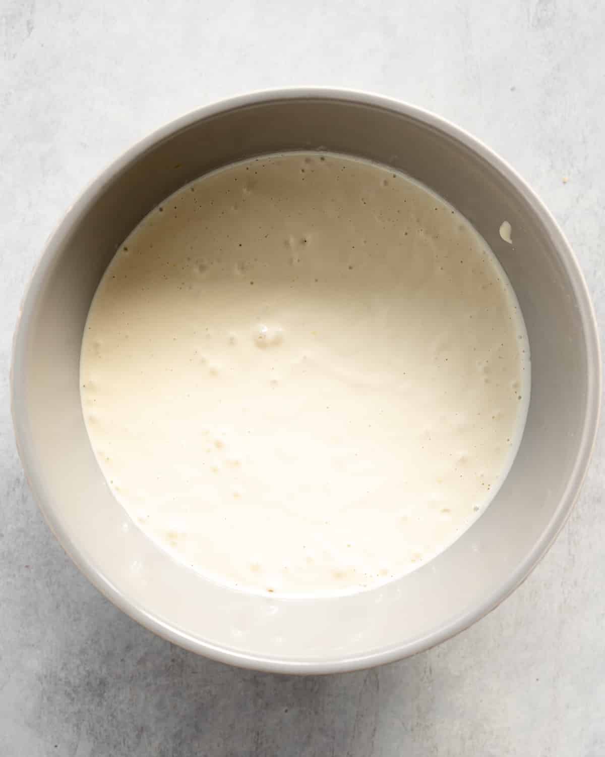 cheesecake filling in a grey bowl.