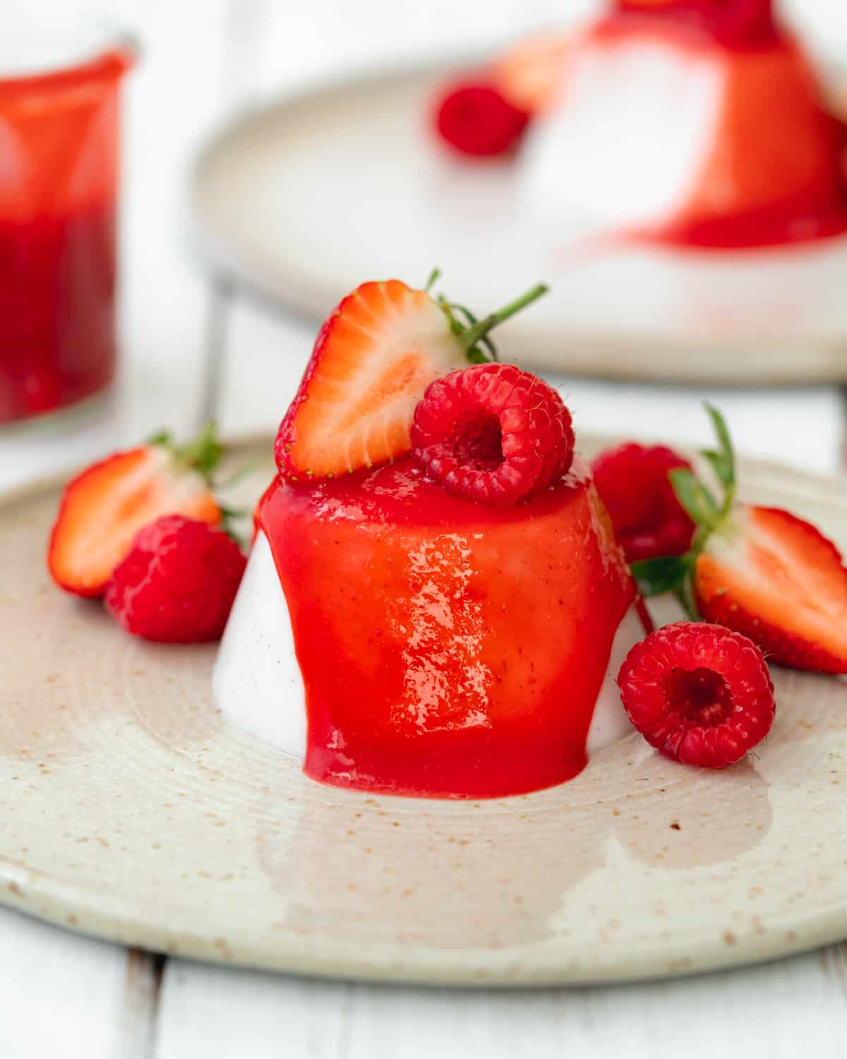 panna cotta without gelatin with fresh strawberries and raspberries.