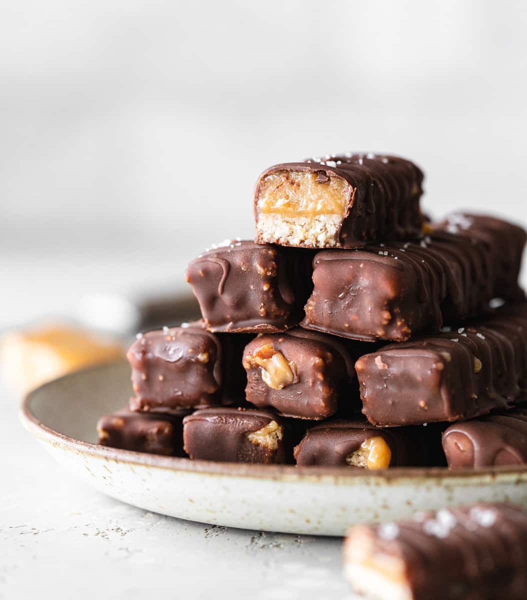 close up of homemade twix bars on plate.