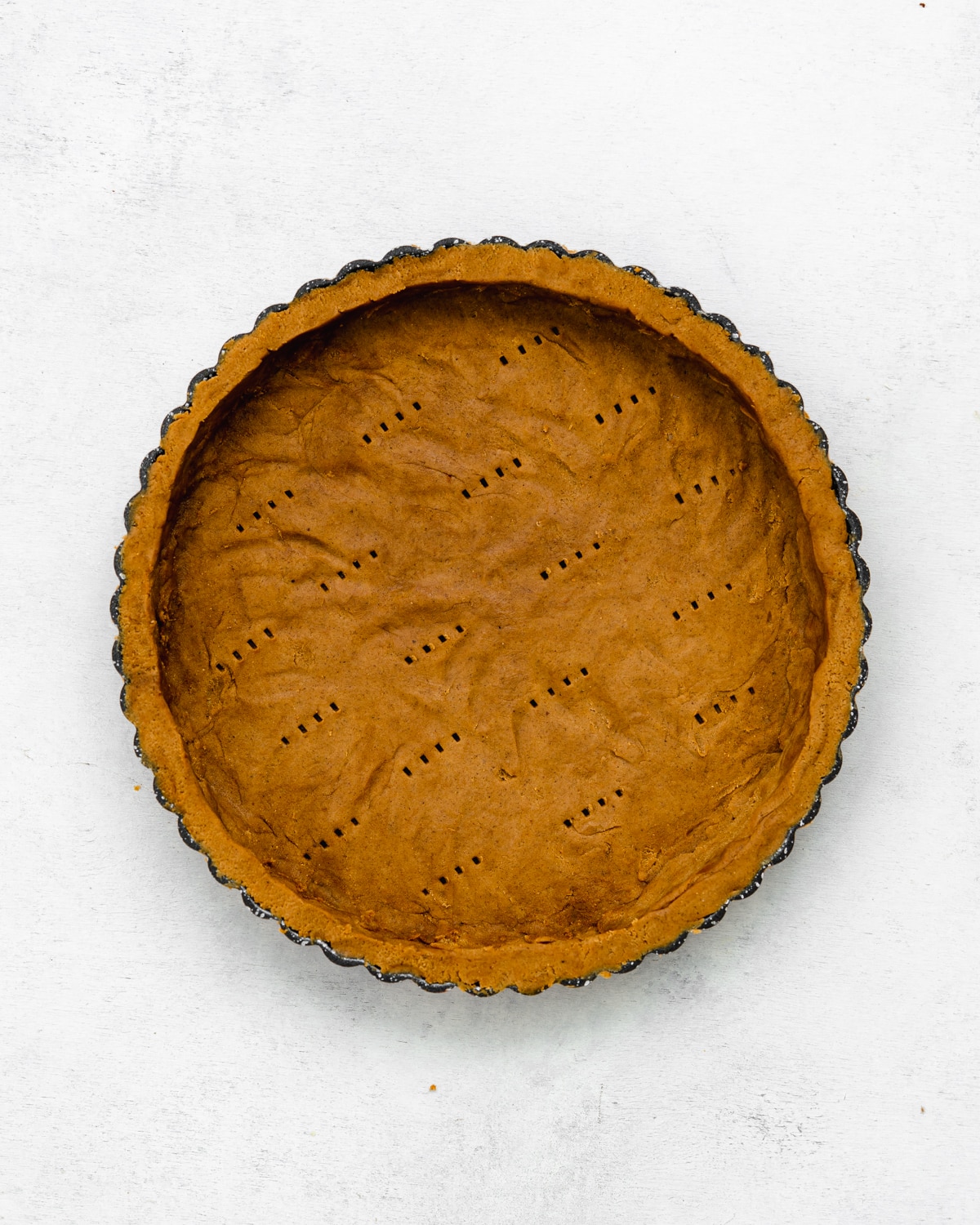 tart tin with gingerbread shortcrust pastry.