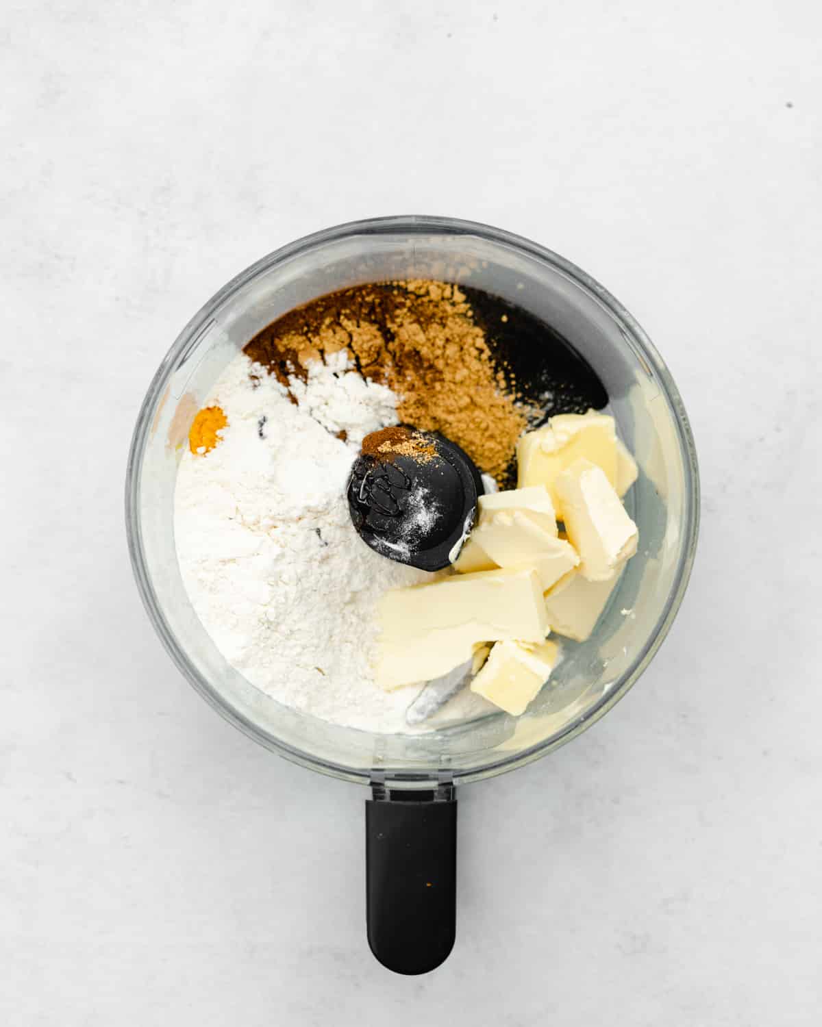 butter, flour, sugar and spices in a food processor.
