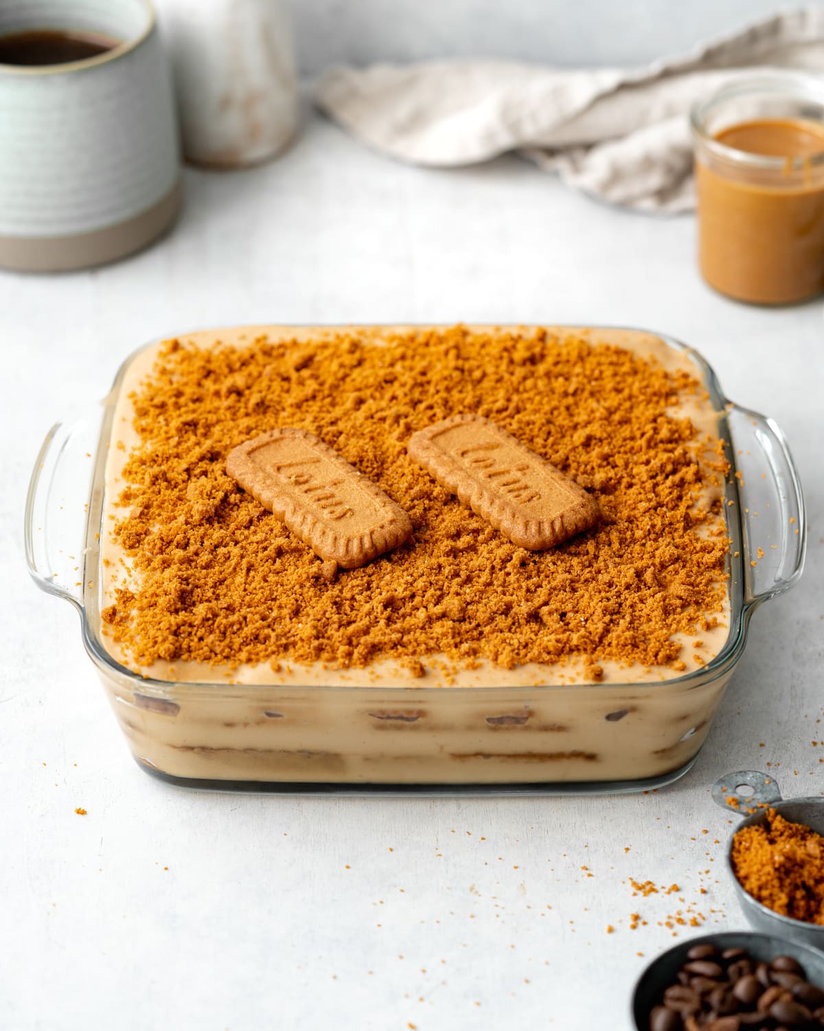 speculoos lasagna with lotus cookies in a glass baking dish.